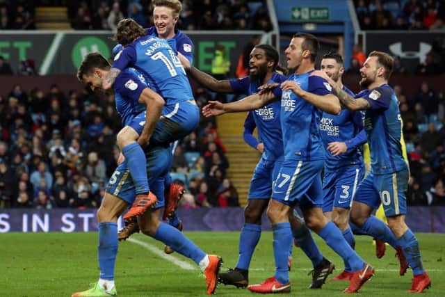 Ryan Tafazolli of Peterborough United celebrates with team-mates after scoring his goal. Picture: Joe Dent/theposh.com.