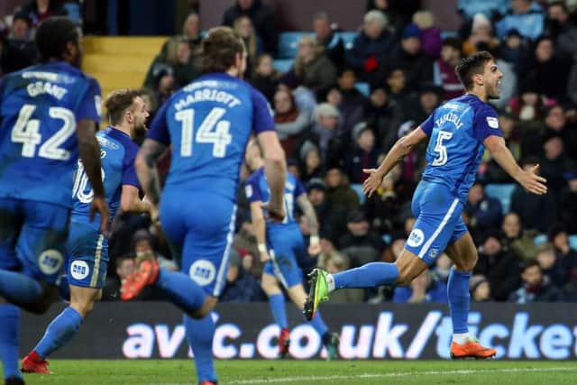 Ryan Tafazolli of Peterborough United celebrates scoring his goal. Picture: Joe Dent