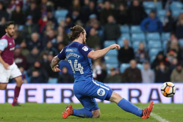 Jack Marriott of Peterborough United scores his sides third goal of the game. Picture: Joe Dent