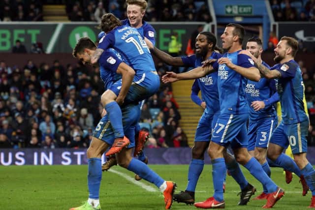 Ryan Tafazolli of Peterborough United celebrates with team-mates after scoring his goal - Mandatory by-line: Joe Dent/JMP - 06/01/2018 - FOOTBALL - Villa Park - Birmingham, England - Aston Villa v Peterborough United - Emirates FA Cup third round proper