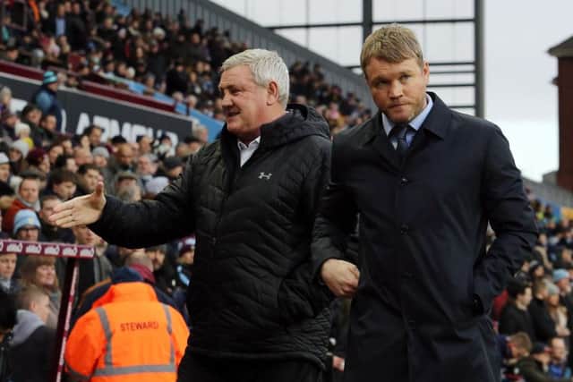 Posh manager Grant McCann (right) and Aston Villa boss Steve Bruce before the game. Picture: Joe Dent/theposh.com.