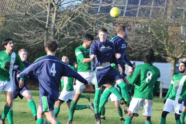 Action from Eye United's 4-0 win at FC Peterborough (green) in the Peterborough League's Intermediate Shield. Photo: David Lowndes.