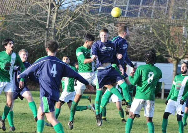 Action from Eye United's 4-0 win at FC Peterborough (green) in the Peterborough League's Intermediate Shield. Photo: David Lowndes.