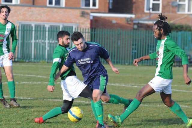 Action from Eye (blue) v FC Peterborough in the Intermediate Shield. Photo: David Lowndes.
