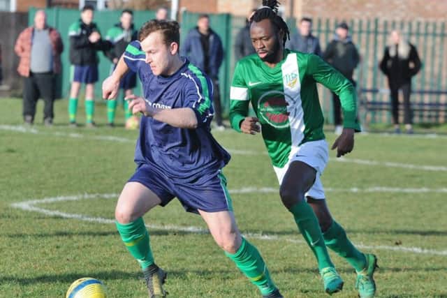 Eye United (blue) go on the attack during a 4-0 win over FC Peterborough at Fulbridge Road. Photo: David Lowndes.