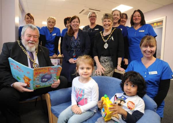 Mayor of Peterborough Coun. John Fox and Mayoress Judy Fox at the opening of a new extension to the St Thomas More Catholic Nursery with manager Christine Kurys and some of the children and staff at the nursery. EMN-180801-155246009