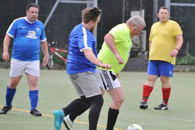 Football action from Phatsolna v Chipswich team at the Embankment in the Men v Fat leaque. EMN-170815-084858009