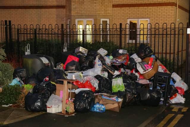 Piles of rubbish left uncollected outside Townsend Close. Picture by Terry Harris. THA