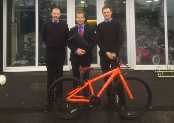 New move: from left, Paul Bonham of Terry Wright Cycles, Alex Spires of Barclays and Ben Fletcher, employee of Terry Wright Cycles.