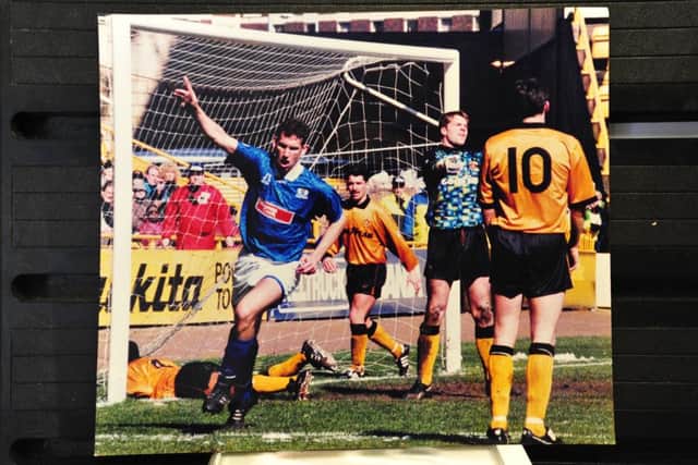 John McGlashan celebrates a Posh goal.