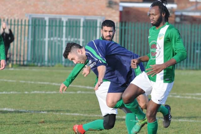 Action from Eye United's 4-0 win at FC Peterborough (green). Photo: David Lowndes.