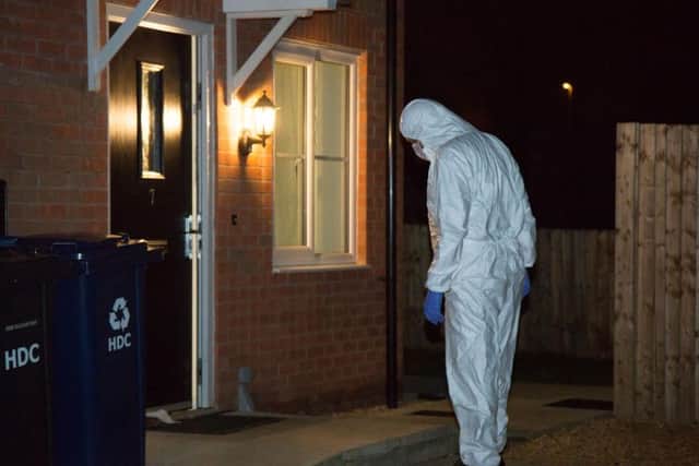 Police at a property in Whitney Drive. Photo: Terry Harris