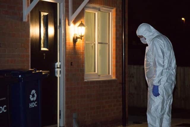 Police at a property in Whitney Drive. Photo: Terry Harris
