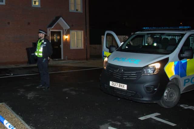 Police at a property in Whitney Drive. Photo: Terry Harris