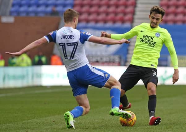 Posh right-back Liam Shephard in action woth Michael Jacobs of Wigan. Joe Dent/theposh.com.