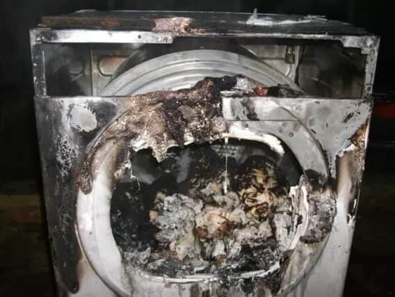 One of the burnt out tumble dryers