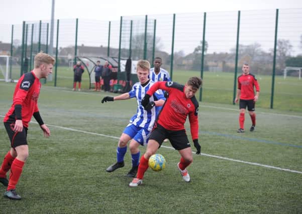 Dan Fountain scored the only goal of the game for Netherton against Peterborough Sports Reserves last weekend. He's seen here (red shirt) in action in that game. Photo: David Lowndes.