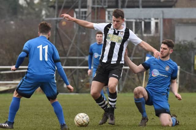 James Hill-Seekings (stripes) of Peterborough Northern Star in action against Desborough Town last weekend. Photo: Chantelle McDonald. @cmcdphotos.