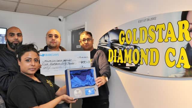 Amina Khan with Nasir Jan, Imhaz Azam and Faz Ali at Goldstar Diamond Cars, Fengate  cheque pres to Macmillan Cancer support. Cash was raised following the auction of a signed Posh football shirt EMN-171219-162049009