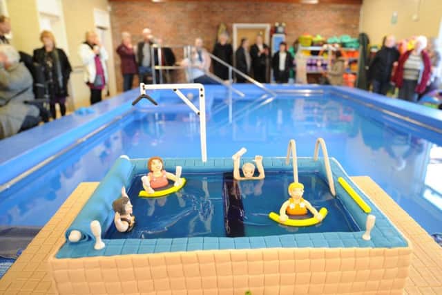 Official re-opening of the St George's Hydrotherapy Pool at Dogsthorpe . Cutting the cake Coun Irene Walsh and  organiser Robert Oldale EMN-180116-172744009