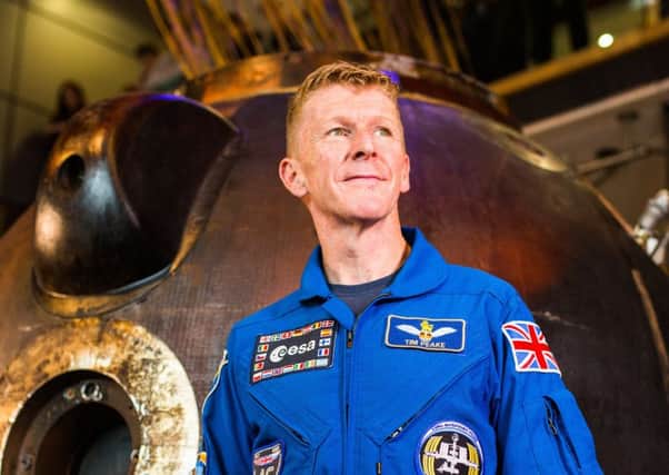Tim Peake with the Soyuz craft which took him to space and back