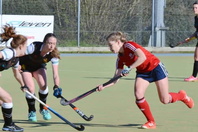 City of Peterborough Ladies captain Robyn Gribble (red).