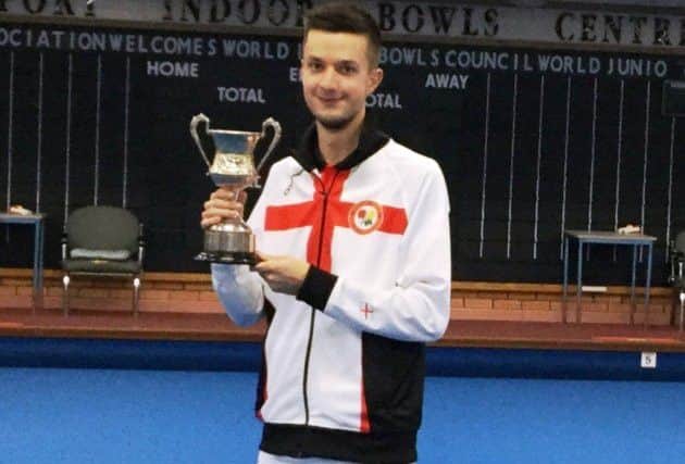 Ed Elmore with his World Under 25 Singles trophy.
