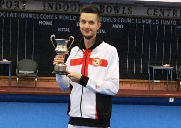 Ed Elmore with his World Under 25 Singles trophy.