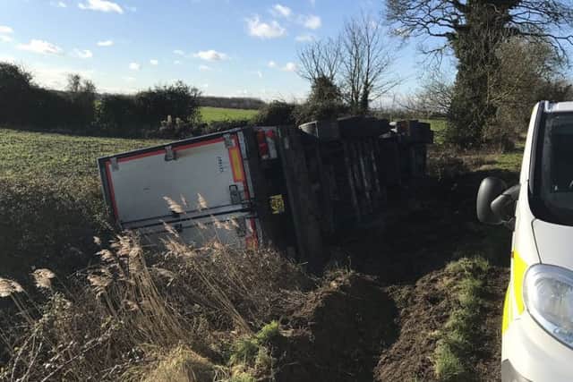 A photo of the overturned lorry from @roadpoliceBCH on Twitter