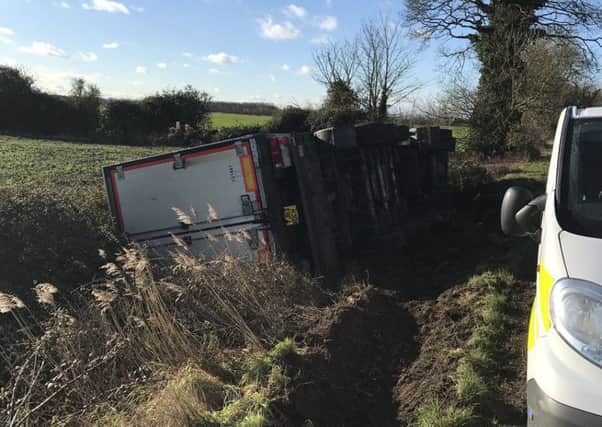 A photo of the overturned lorry from @roadpoliceBCH on Twitter