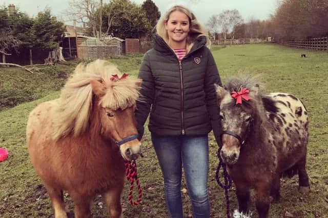 Jade Clube with Elvis and Cookie (right) before a nativity