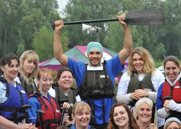 Dragon Boat racing at Thorpe Meadow.  Louis Smith with the Sue Ryder crew EMN-150613-173040009