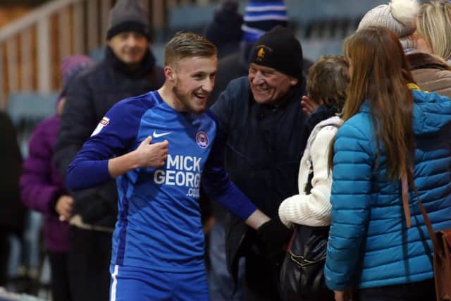 Posh debutant George Cooper celebrates with his own fan club at the end of the Oldham game. Photo: Joe Dent/theposh.com.