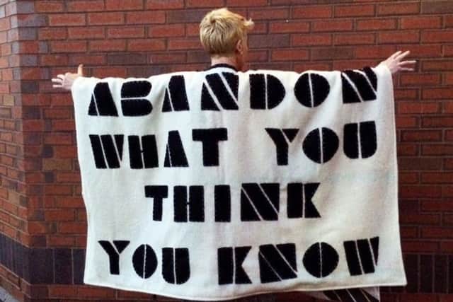 One of the Â hand and machine sewn capes with found sayings  by Kate Genever and Katie Smith