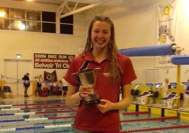 Two-time Lincolnshire county champion Isabel Spinley collects the 100m butterfly trophy