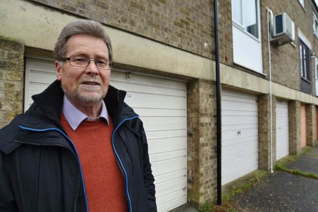 Bernard Champness outside garages at Eyrescroft, Bretton EMN-180124-162628009