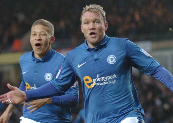 Grant McCann celebrates his match-winning goal for Posh against Leicester in 2013.