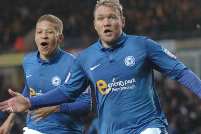 Grant McCann celebrates his match-winning goal for Posh against Leicester in 2013.