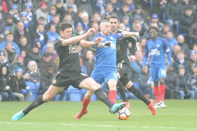 Posh star Marcus Maddison darts inbetween two Leicester players. Photo: David Lowndes.
