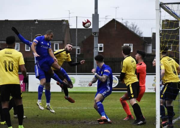 Ollie Medwynter opens the scoring for Peterborough Sports against Belper with a terrific header. Photo: James Richardson.