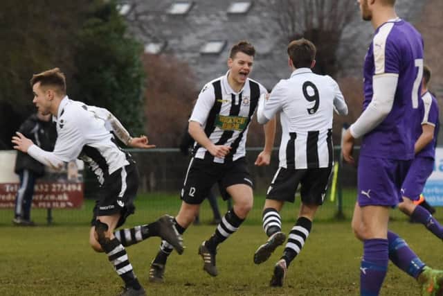 James Hill-Seekings (middle) of Peterborough Northern Star celebrates with team-mates after scoring against Daventry Town. Photo: Chantelle McDonald. @cmcdphotos.