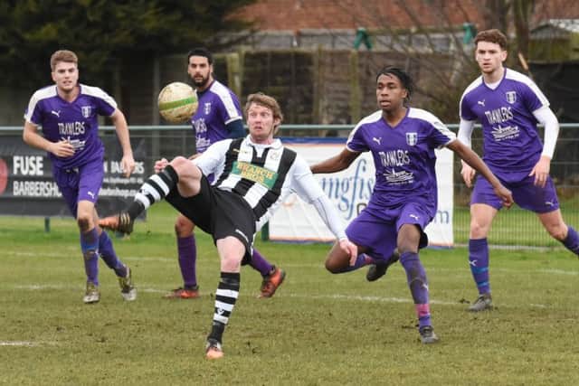 Wayne Morris (stripes) in action for Peterborough Northern Star against Daventry. Photo: Chantelle McDonald. @cmcdphotos.