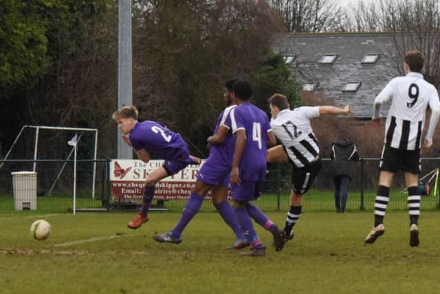 James Hill-Seekings (12) of Peterborough Northern Star scores against Daventry Town. Photo: Chantelle McDonald. @cmcdphotos.