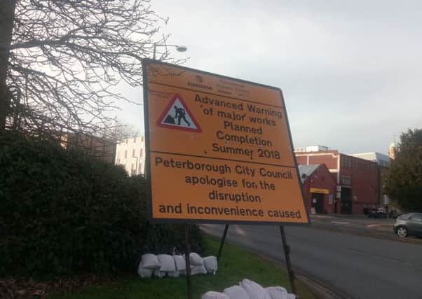Signs warning about the upcoming roadworks