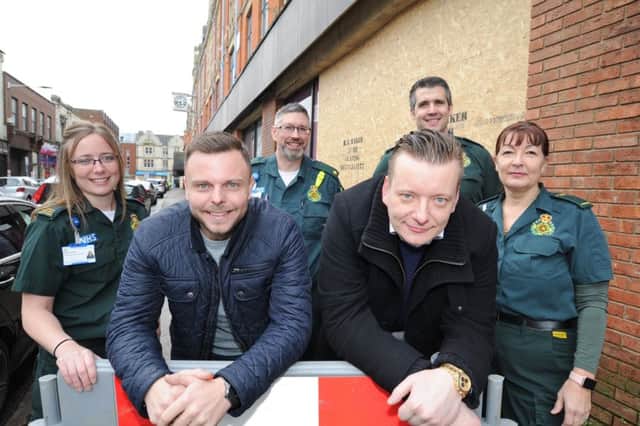 Dean Taylor (left) and Marcin Goralski who saved an RTC victim's life at the scene in Park Road. They are with ambulance staff Rachel Dodman (wearing glasses), Kerry Quy, Daniel Oldland (beard) and Adam Bright who also attended the scene. EMN-180131-124350009