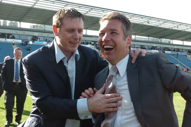 Posh manager Darren Ferguson (right) and chairman Darragh MacAnthony celebrate a promotion.