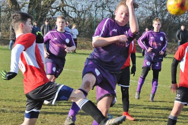 Action from the Under 14 cup game between Wisbech St Mary and Whittlesey Reds.