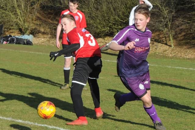 Action from the Under 14 cup game between Wisbech St Mary and Whittlesey Reds.