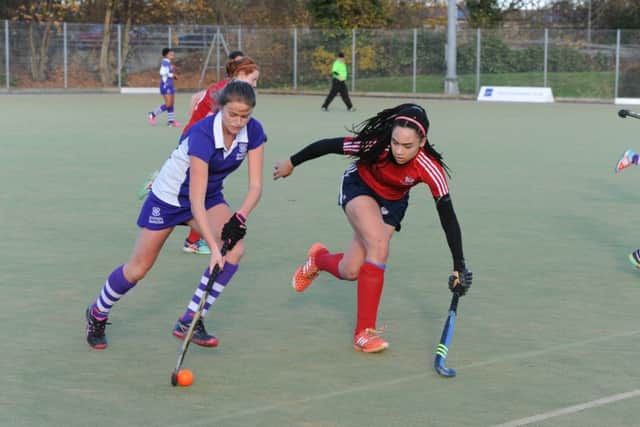 Tierney Augustine (red) in action for City of Peterborough Ladies.