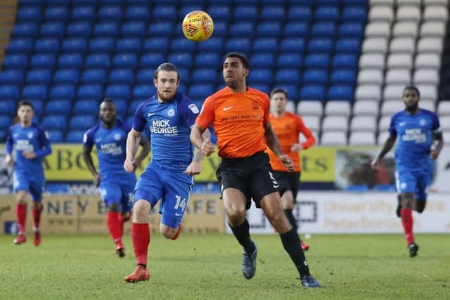 Posh striker Jack Marriott chases after Southend's Anton Ferdinand. Photo: Joe Dent/theposh.com.
